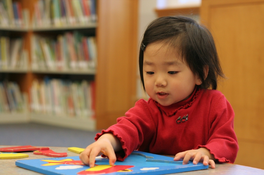 child with puzzle