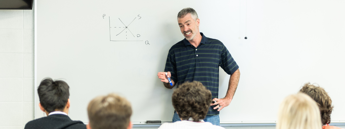 Dr. David Zimmer instructs an Economics class.