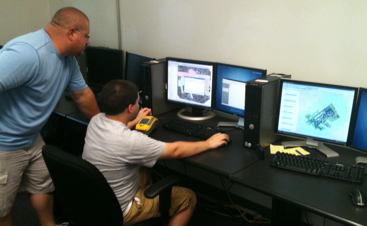 GIS Interns J. Montgomery ('12) and D. Horn ('12). GIS Interns working on a planning project.