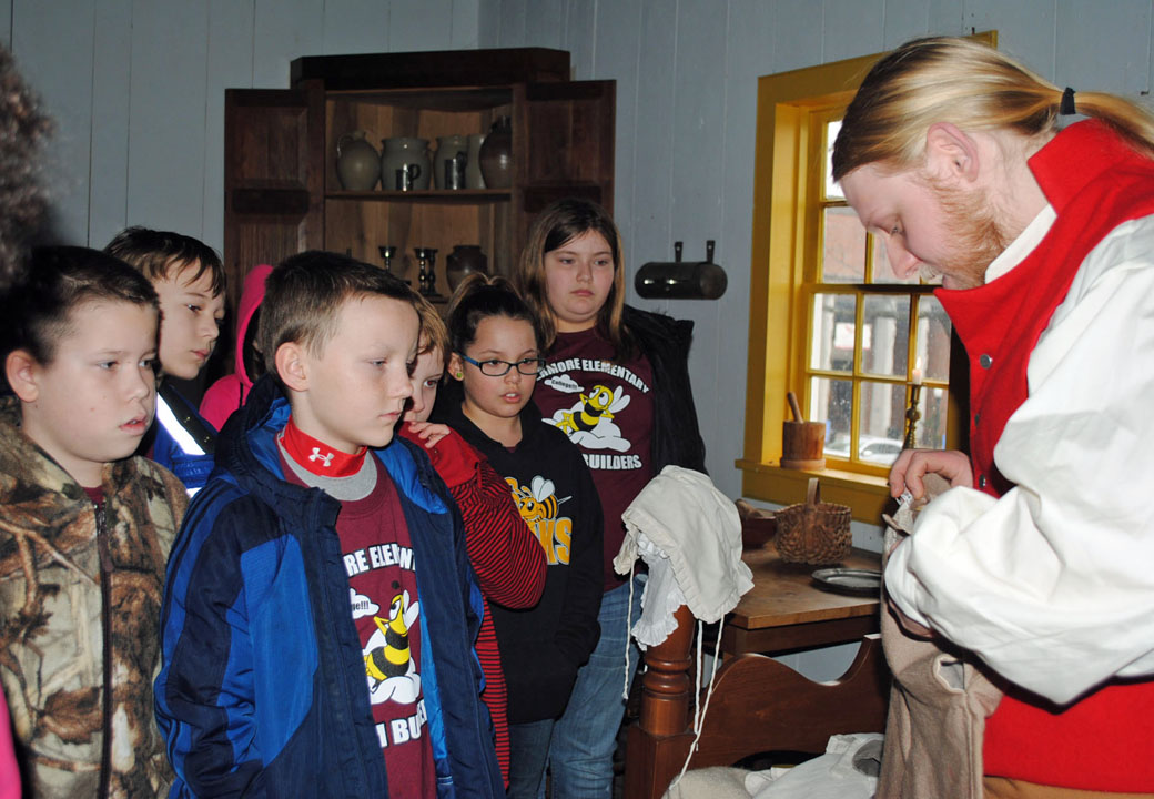 students in Felts house with 1800s era costumes