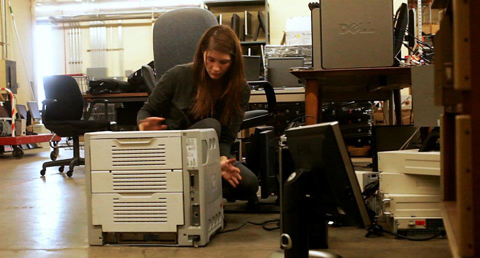 Sara looking at printer