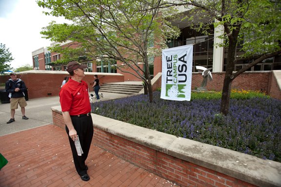 Former President Gary Ransdell with Tree Campus USA Flag