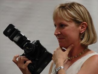 A picture of Jeanie Adams Smith holding camera