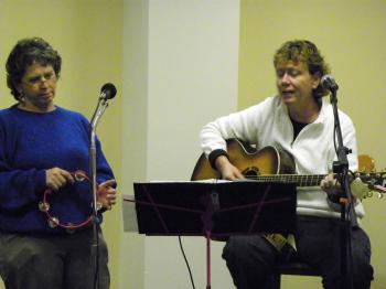 A picture of Susan Morris and Molly Kerby singing