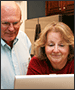 older couple working on laptop
