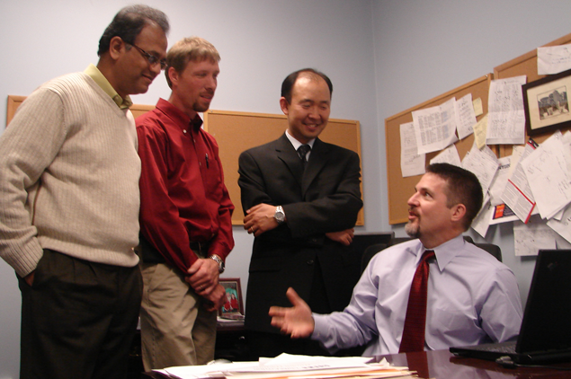 Photo of Management faculty meeting in the Center for Entrepreneurship. Photo of Management faculty meeting in the Center for Entrepreneurship.