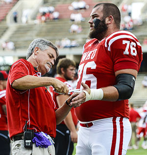 Football player being taped