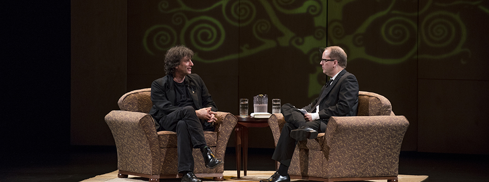 #caption8 Author and WKU English Prof David Bell interviews author Neil Gaiman on stage at Van Meter, photo by William Kolb