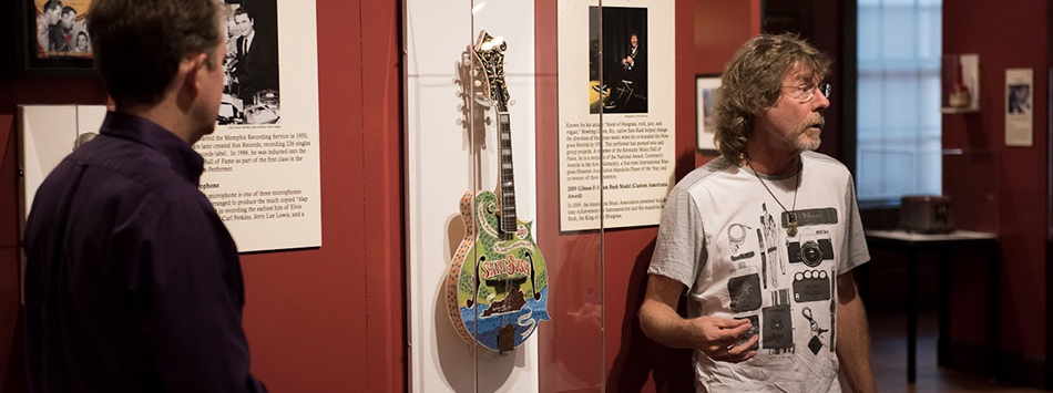 #caption7 Sam Bush provided a mandolin as part of the Instruments of American Excellence exhibition at the Kentucky Museum. The mandolin was given to Bush from the Americana Music Association as a gift for receiving the lifetime achievement for instrumentalist honor in 2009. Photo by William Kolb.