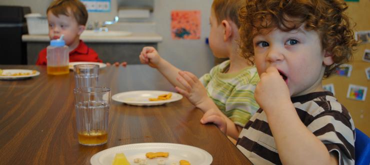 #caption4 children having snack at ECC
