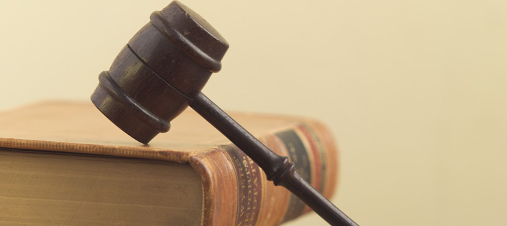 #caption3 Symbols of Law, the gavel and lawbook