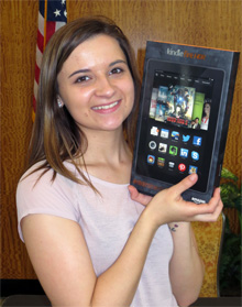 Madison Wagner holding her Kindle Fire HDX