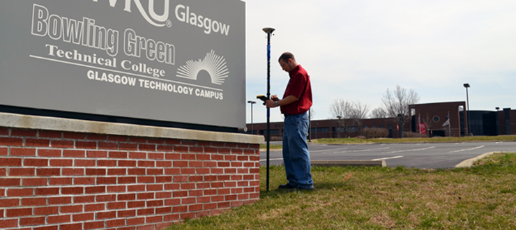 #caption7 PDC’s current GIS-GPS Intern collecting features data at WKU Glasgow Campus.