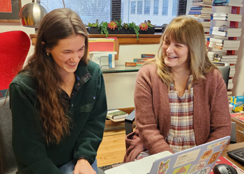 Student and teacher working together.