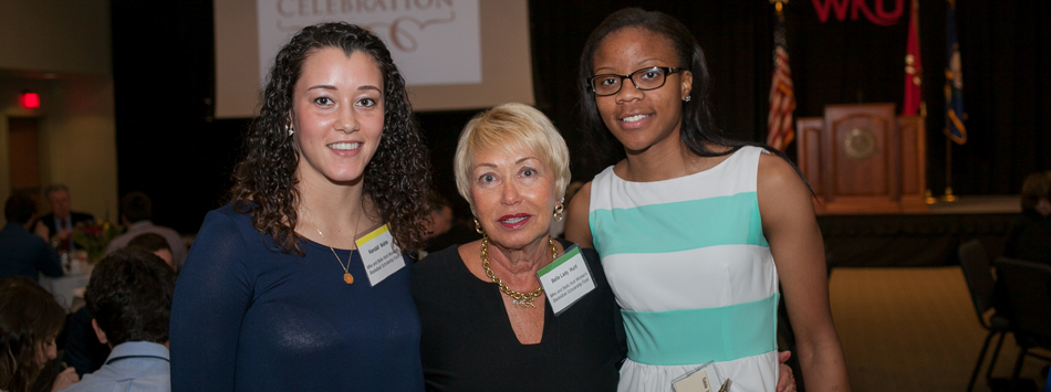 #caption3 Belle Hunt (center) poses with recipients of the Mike and Belle Hunt Scholarship, Kendall Noble and Tashia Brown.
