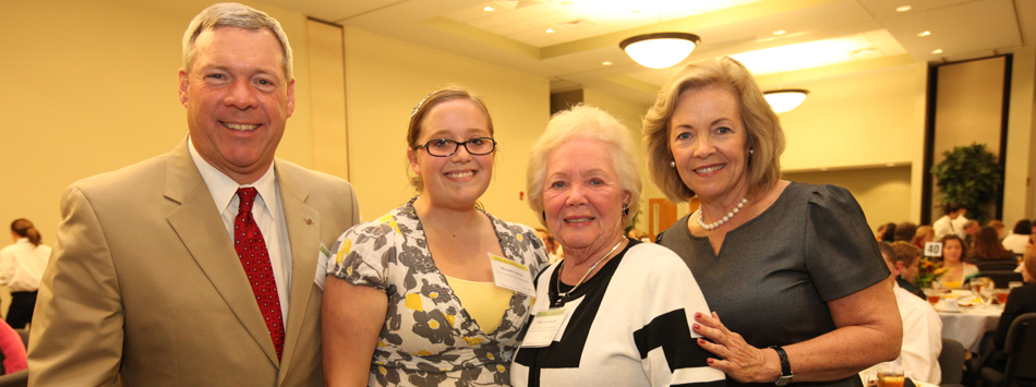 #caption6 Ben Smith, Betty Lou Smith, and Paul Smith Dermody pose with Miranda Spinks, recipient of the Betty Lou Smith Family Scholarship