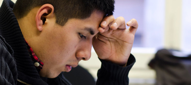 Student concentrating taking an exam