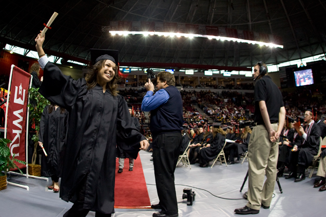 Photo of student graduating by Clinton Lewis.