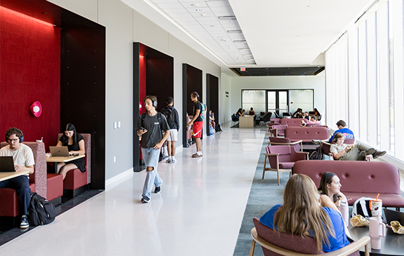 Students sitting in and walking through Chandler Hall at WKU