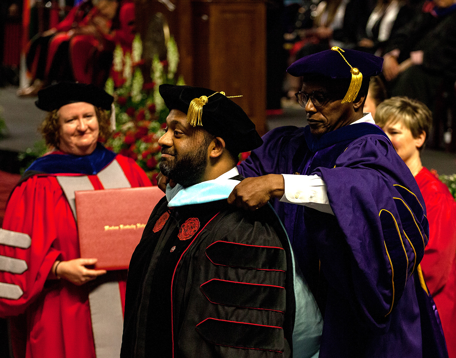 A Ed.D doctoral student during the hooding ceremony during fall commencement.