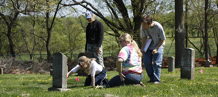 Faculty and students recording headstones