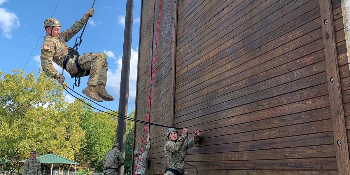 WKU ROTC LLC students swinging down a wall