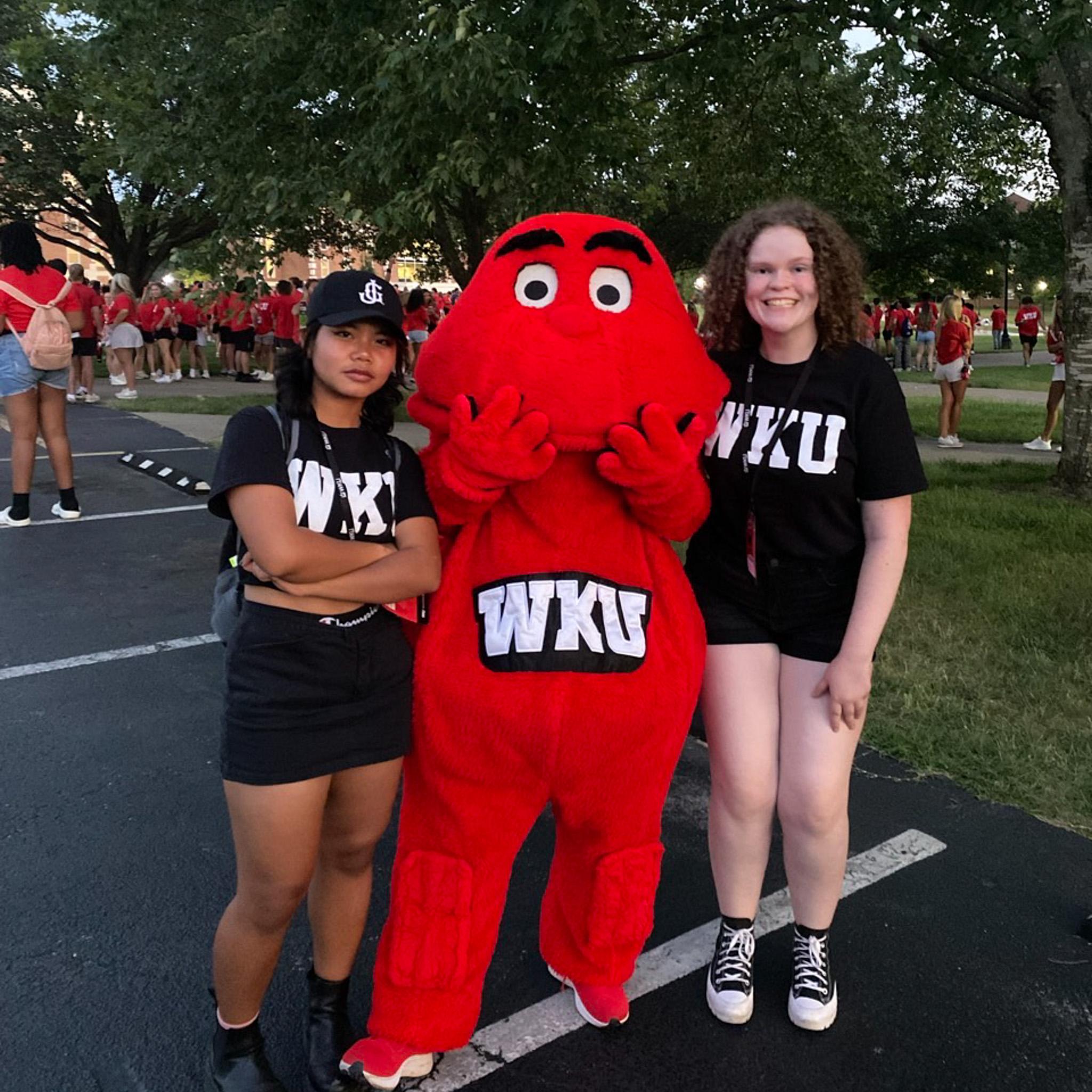 MASTER Plan Mentors smiling with Big Red for a photo