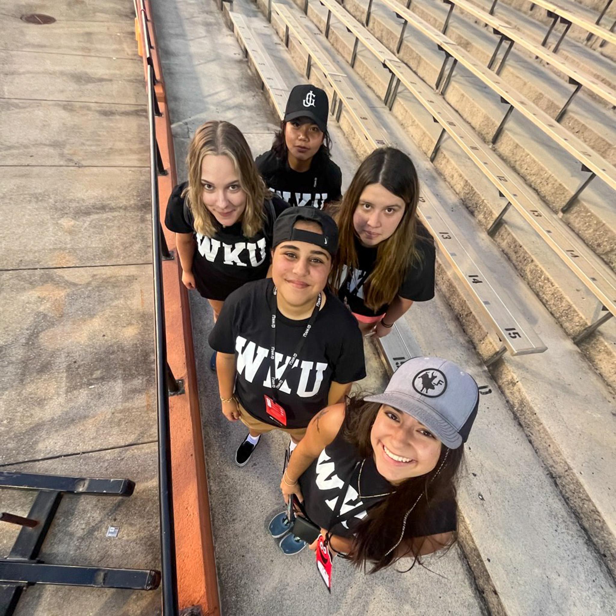 MASTER Plan Mentors smiling for a selfie on the football stands