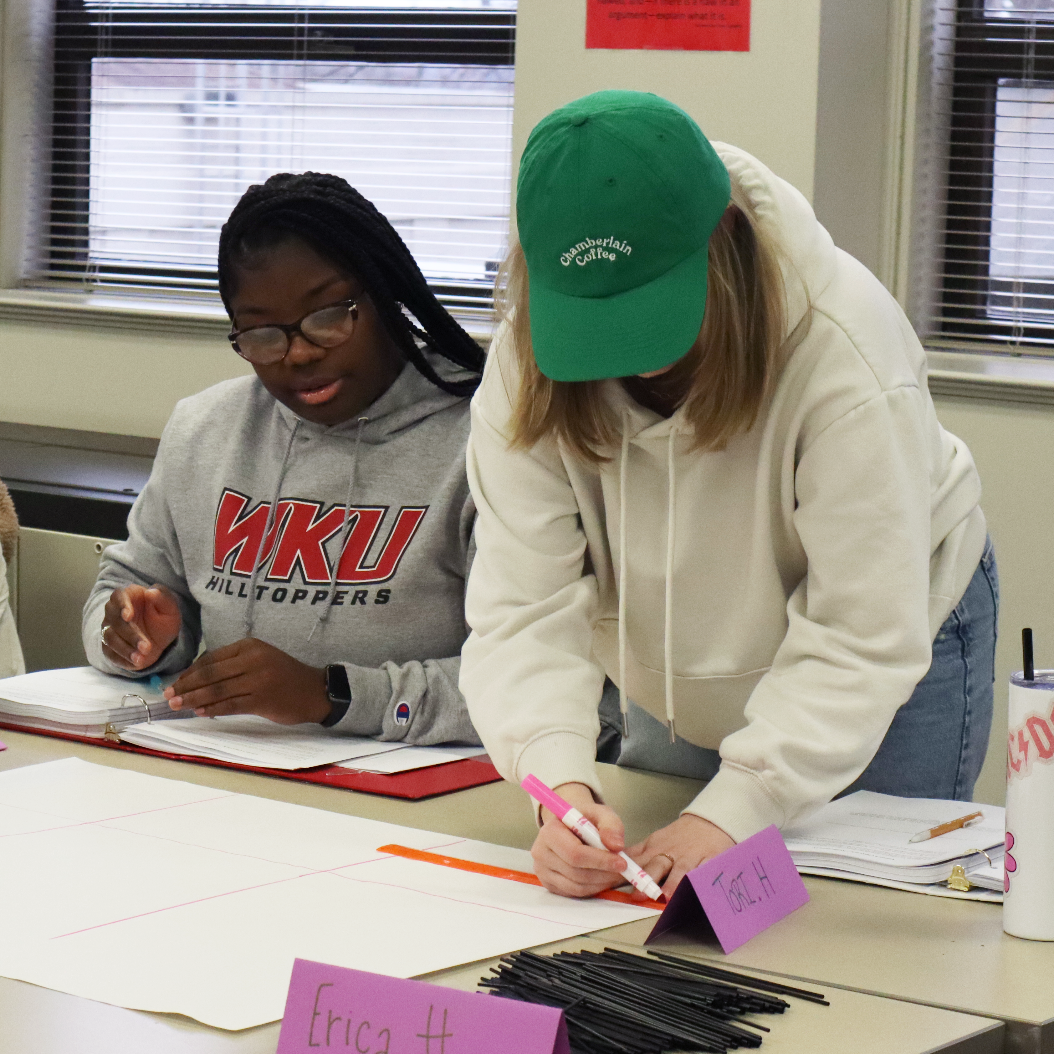 Two WKU students work together in a Math class.