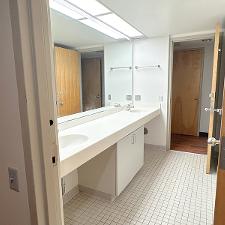 Bathroom area with vanity, locking doors