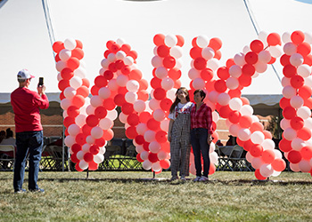 Family in front of WKU sign