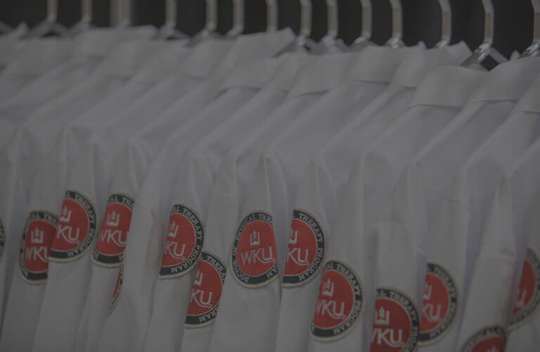 WKU Physical Therapy program jackets hung up in a row